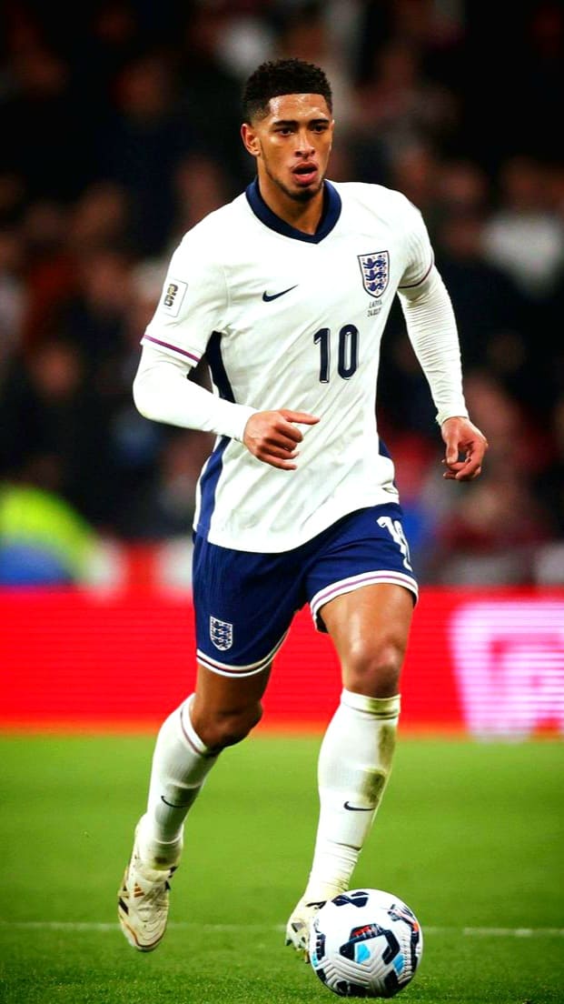 A male England soccer player wearing a white jersey with the number 10 runs on the field, dribbling a soccer ball during a match, as seen live on Romania IPTV.
